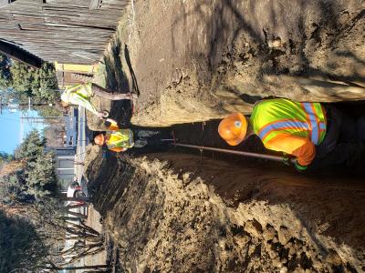 Public Works Crew laying pipe in an alley